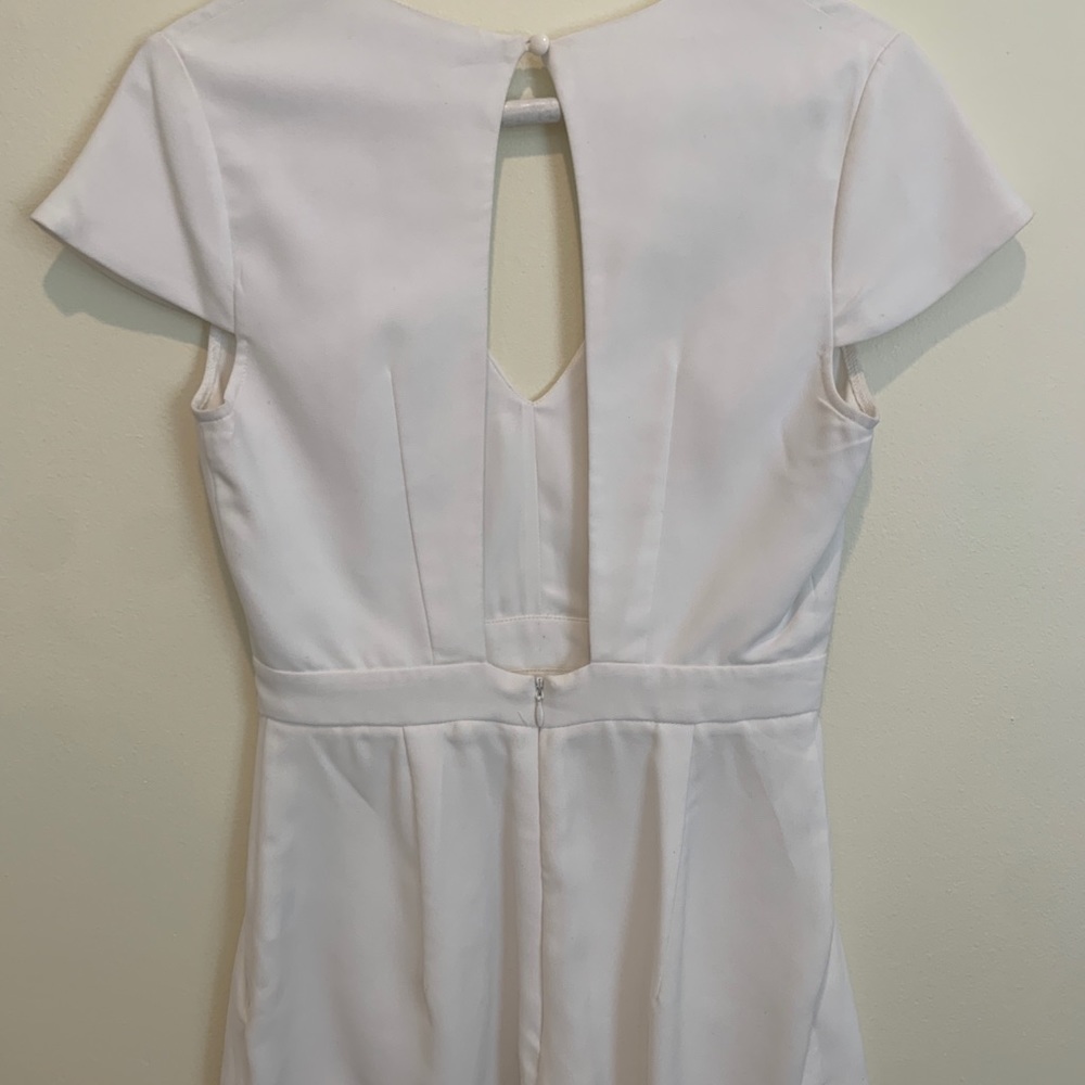White romper with front panels and back cutout